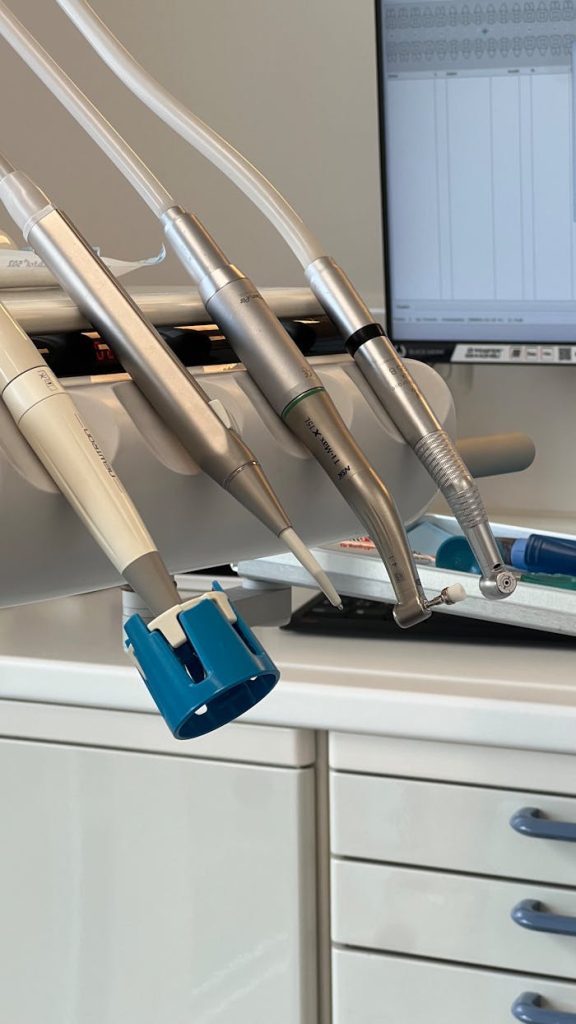 Dental tools neatly arranged in a dentist's office, ideal for healthcare or medical settings.